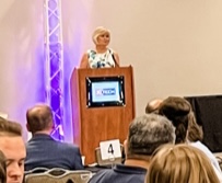 Ktech Dorothy Haven at podium during graduation ceremony